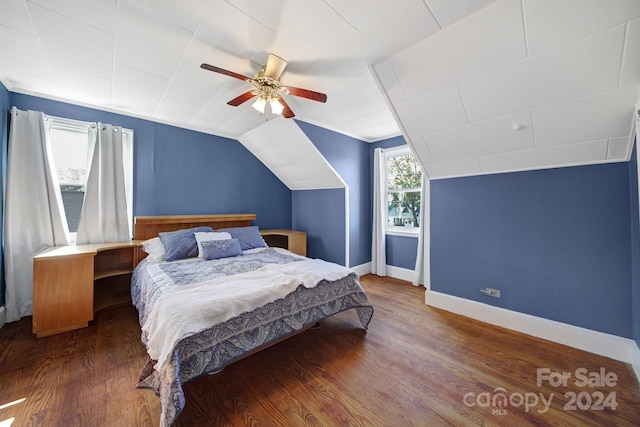 bedroom featuring ceiling fan, dark wood-type flooring, and vaulted ceiling