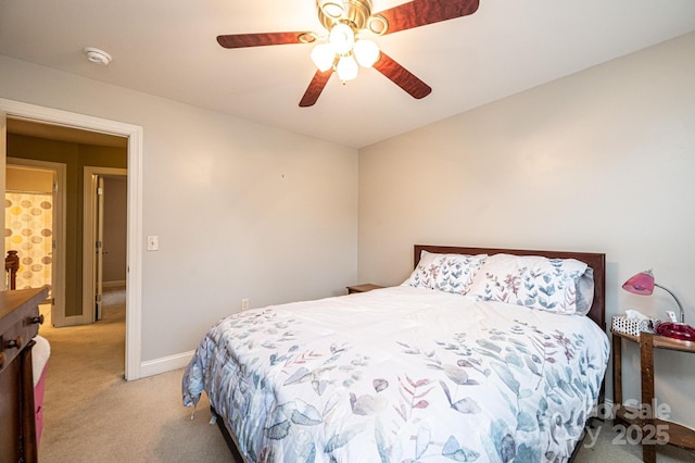 bedroom with light carpet and ceiling fan