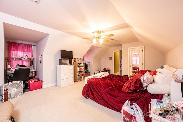 bedroom with light carpet, vaulted ceiling, and ceiling fan