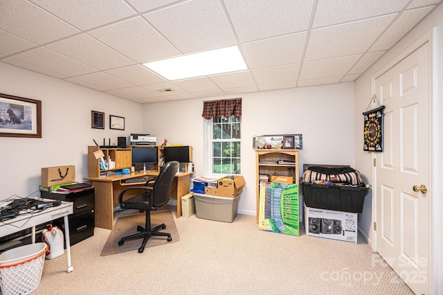 home office featuring a drop ceiling and carpet