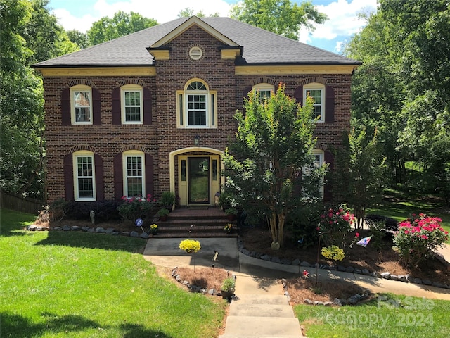 colonial home with a front yard