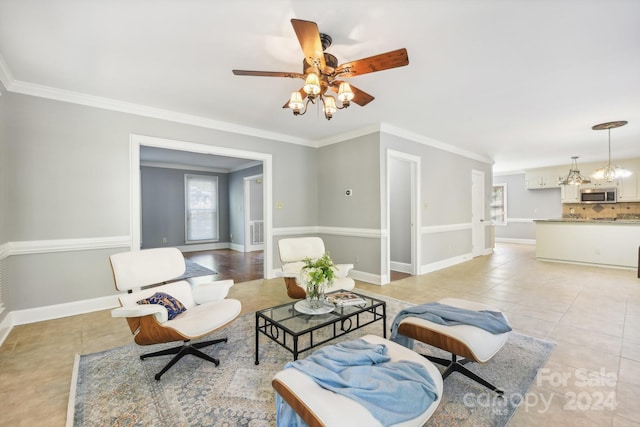 tiled living room with ornamental molding and ceiling fan with notable chandelier