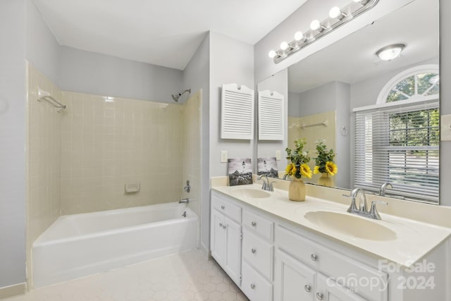 bathroom with vanity, tile patterned floors, and tiled shower / bath combo