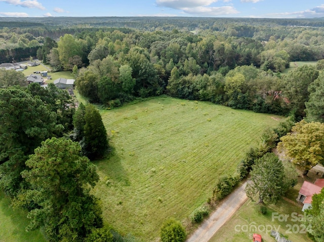 birds eye view of property with a rural view