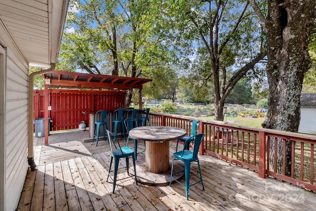 wooden deck featuring a pergola