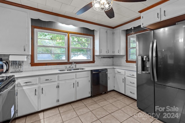 kitchen featuring stainless steel appliances, white cabinets, light tile patterned floors, and sink