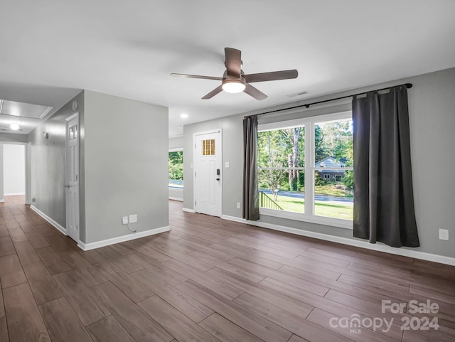 unfurnished room featuring wood-type flooring and ceiling fan