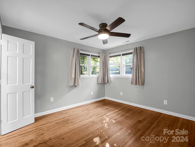 unfurnished room featuring wood-type flooring and ceiling fan