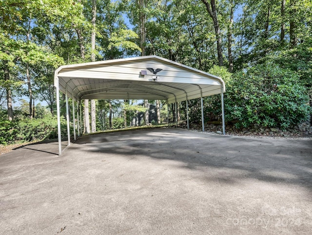 view of parking / parking lot featuring a carport