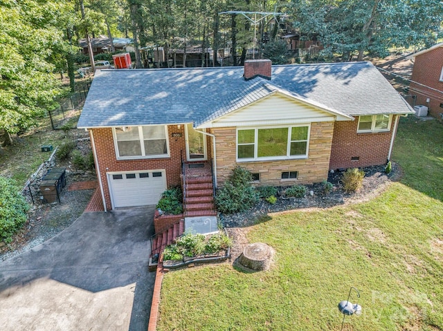 view of front of property with a garage and a front yard