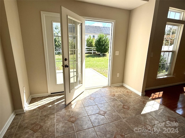 doorway to outside featuring dark wood-type flooring