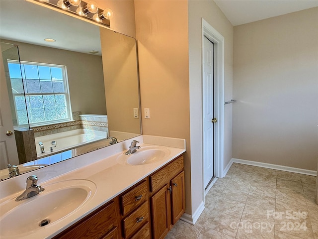 bathroom with vanity, tile patterned floors, and a tub