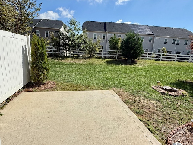 view of yard with an outdoor fire pit and a patio area