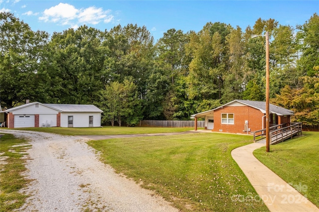 view of yard with an outdoor structure and a garage