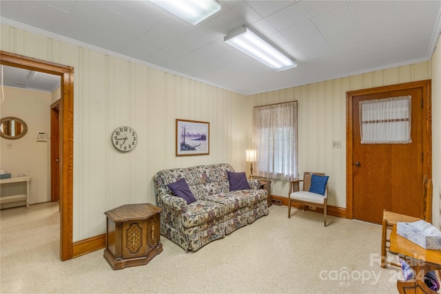 carpeted living room with crown molding