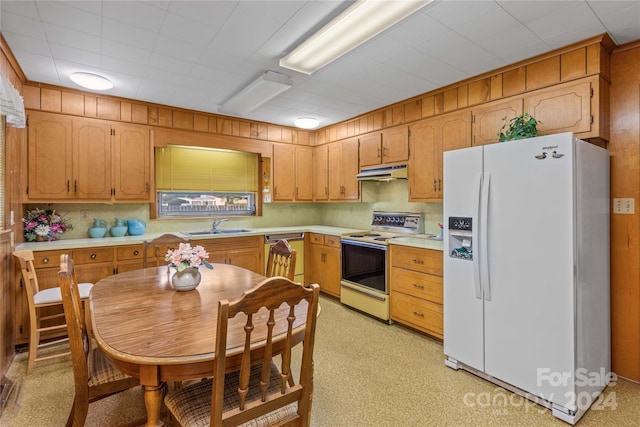 kitchen with white appliances and sink