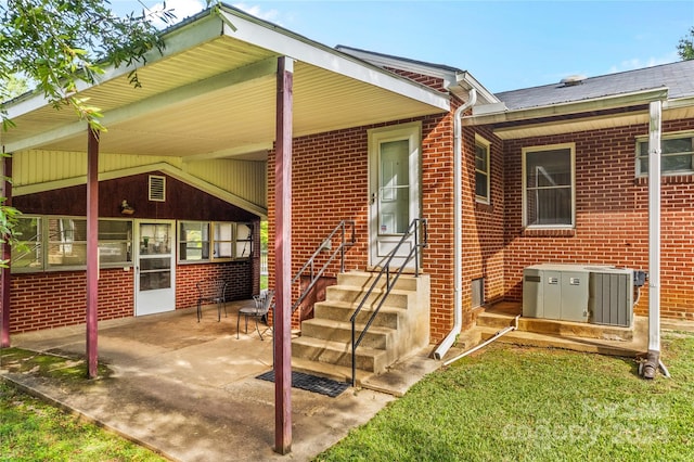 rear view of property with central AC unit