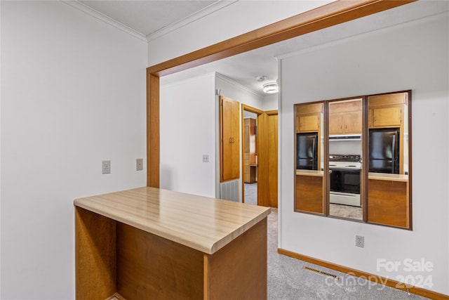 kitchen with light colored carpet, crown molding, black refrigerator, and white range oven