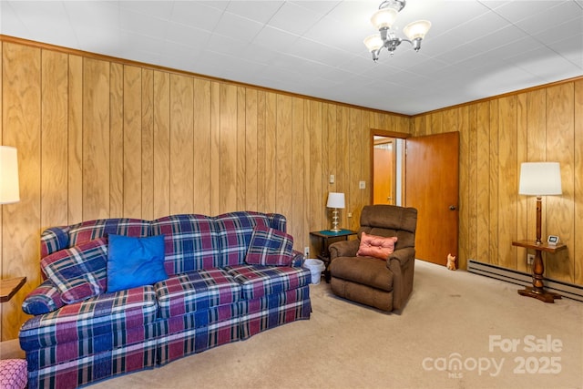 carpeted living room with wooden walls, ornamental molding, and baseboard heating