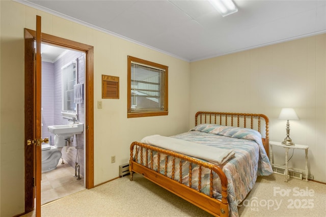 carpeted bedroom with a baseboard radiator and ornamental molding