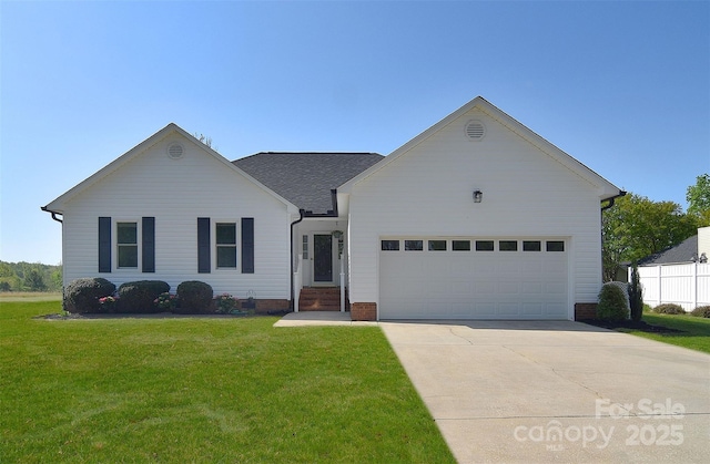 ranch-style house featuring a front lawn, an attached garage, and concrete driveway