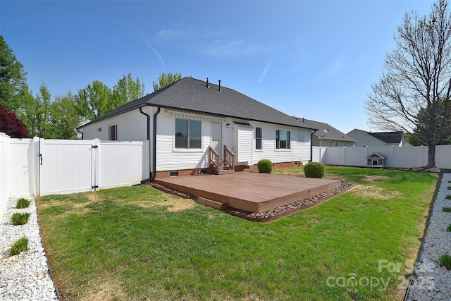 back of property featuring a yard, a fenced backyard, a gate, and crawl space