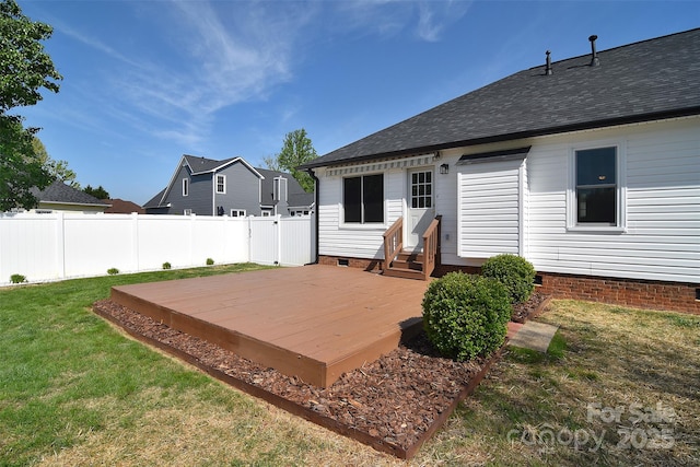 rear view of property with crawl space, a lawn, entry steps, fence, and a deck