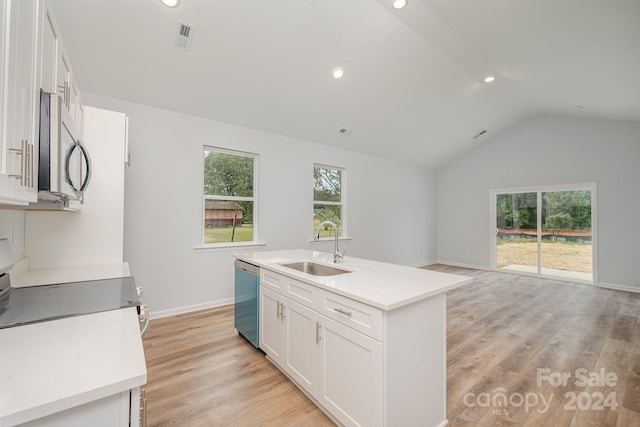 kitchen with white cabinets, a kitchen island with sink, appliances with stainless steel finishes, and sink