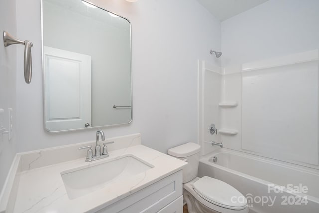 full bathroom featuring vanity, toilet, and shower / washtub combination