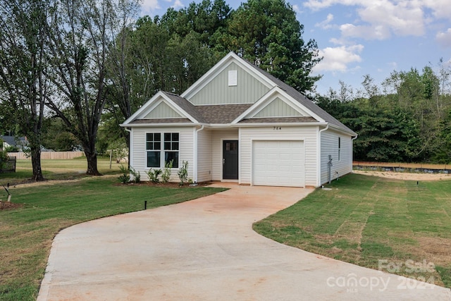 view of front facade featuring a garage and a front lawn