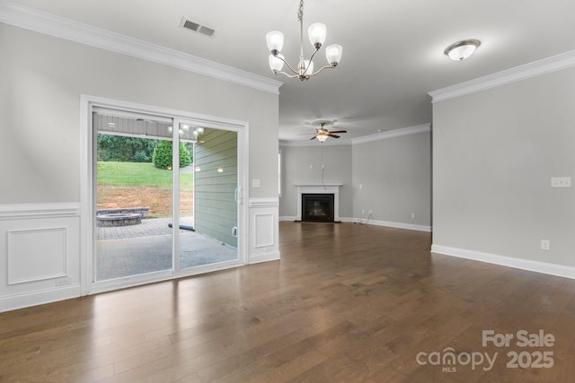 unfurnished living room with crown molding, dark hardwood / wood-style flooring, and ceiling fan with notable chandelier