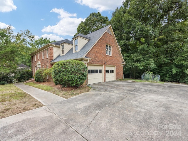 view of home's exterior featuring a garage