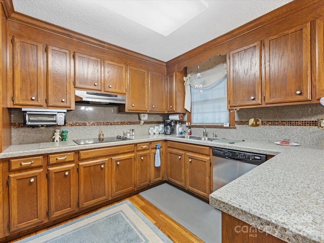 kitchen with dishwasher, sink, light hardwood / wood-style flooring, a textured ceiling, and black electric stovetop