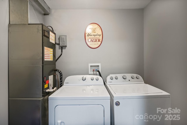 washroom featuring washing machine and dryer