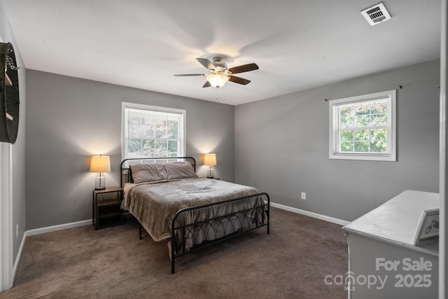 bedroom featuring dark colored carpet and ceiling fan