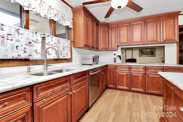 kitchen with ceiling fan, sink, tasteful backsplash, light hardwood / wood-style flooring, and dishwasher