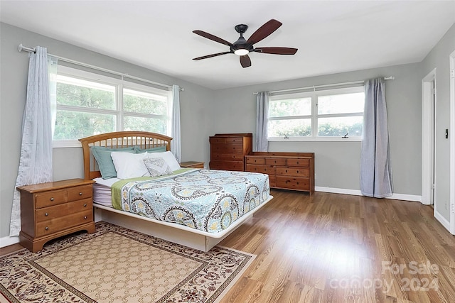 bedroom featuring hardwood / wood-style flooring and ceiling fan