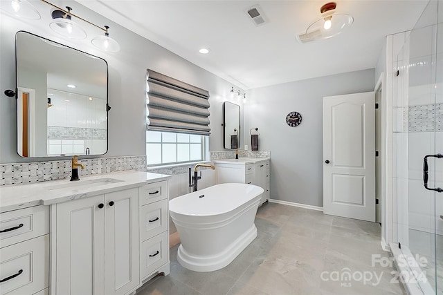 bathroom featuring vanity, shower with separate bathtub, backsplash, and tile patterned flooring