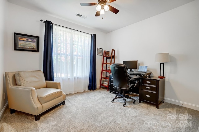 office space with light carpet and ceiling fan