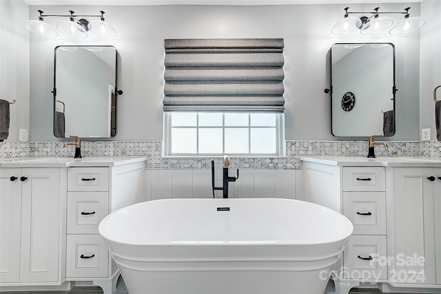 bathroom featuring a tub and vanity