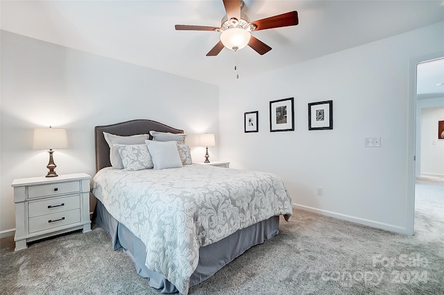 bedroom featuring ceiling fan and carpet