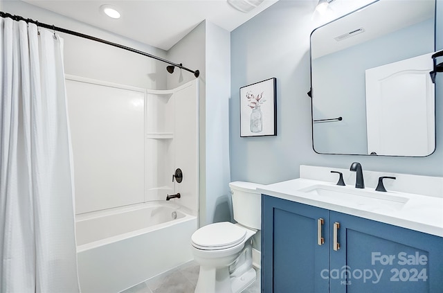 full bathroom with vanity, shower / tub combo, toilet, and tile patterned flooring