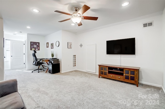 carpeted living room featuring ceiling fan