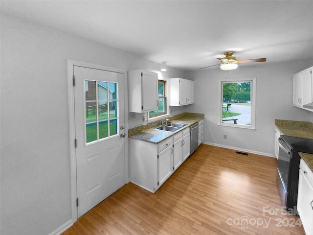 kitchen featuring ceiling fan, sink, white cabinetry, stainless steel appliances, and light wood-type flooring