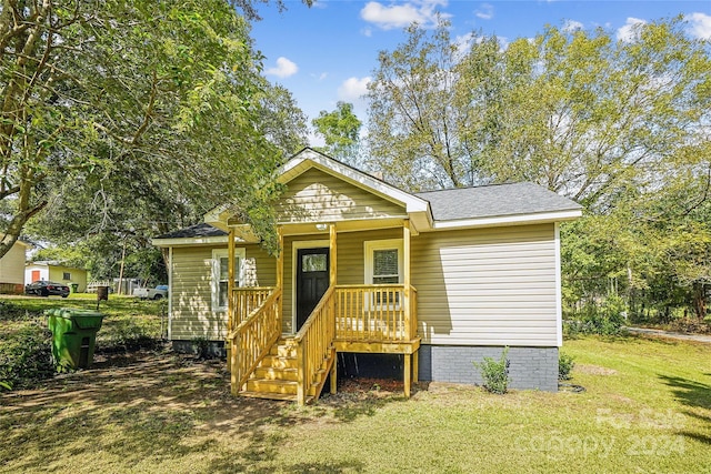 view of front of house with a front lawn and a porch