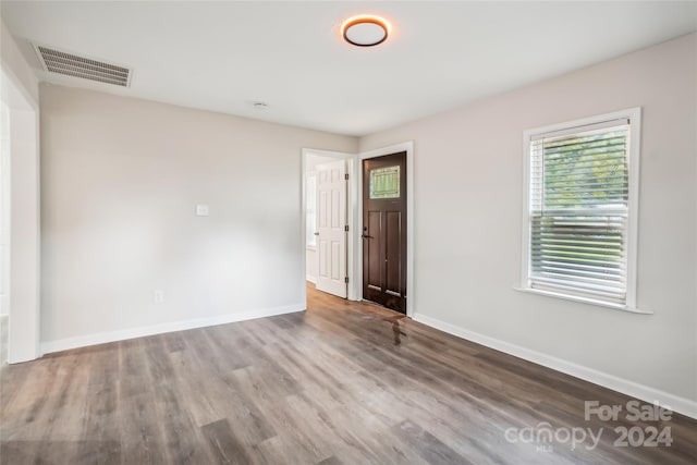 spare room with hardwood / wood-style flooring