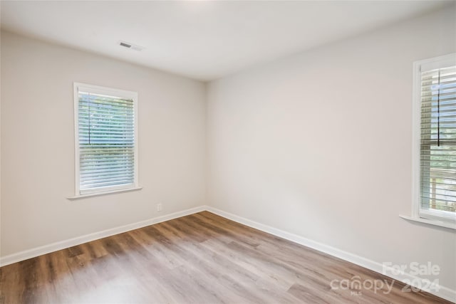 spare room with light wood-type flooring