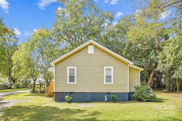 view of home's exterior featuring a yard