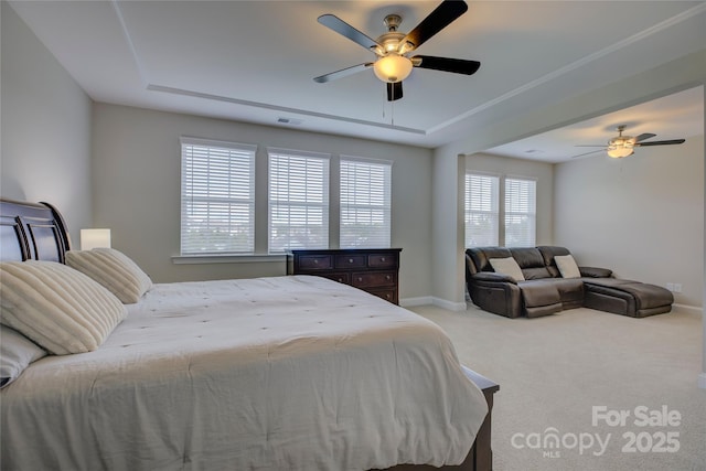 bedroom with ceiling fan and light carpet