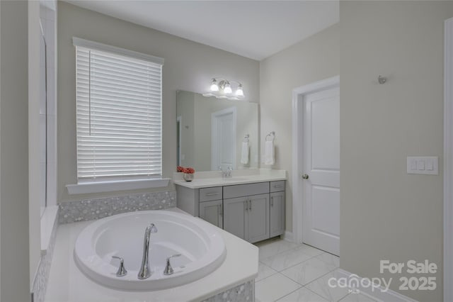 bathroom featuring vanity and a relaxing tiled tub